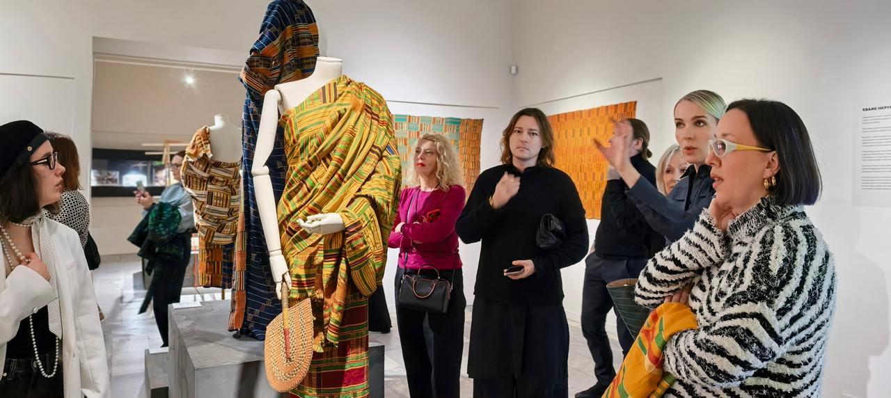 Visitors look at Ghanaian Kente cloth on display at the exhibition in Moscow